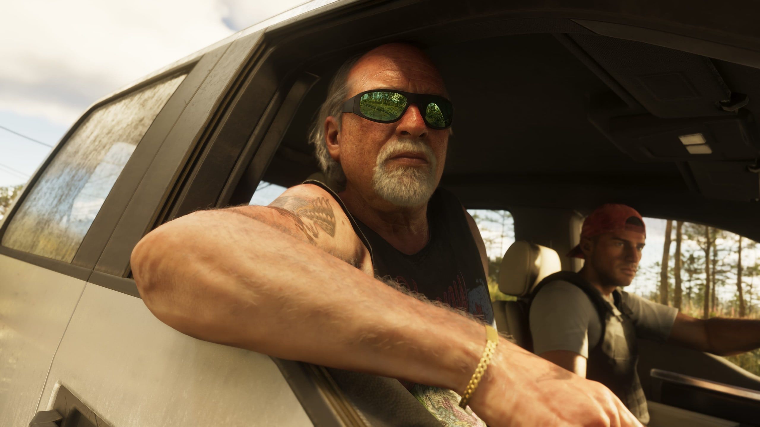 Brian leans out of the passenger window as Jason drives.
